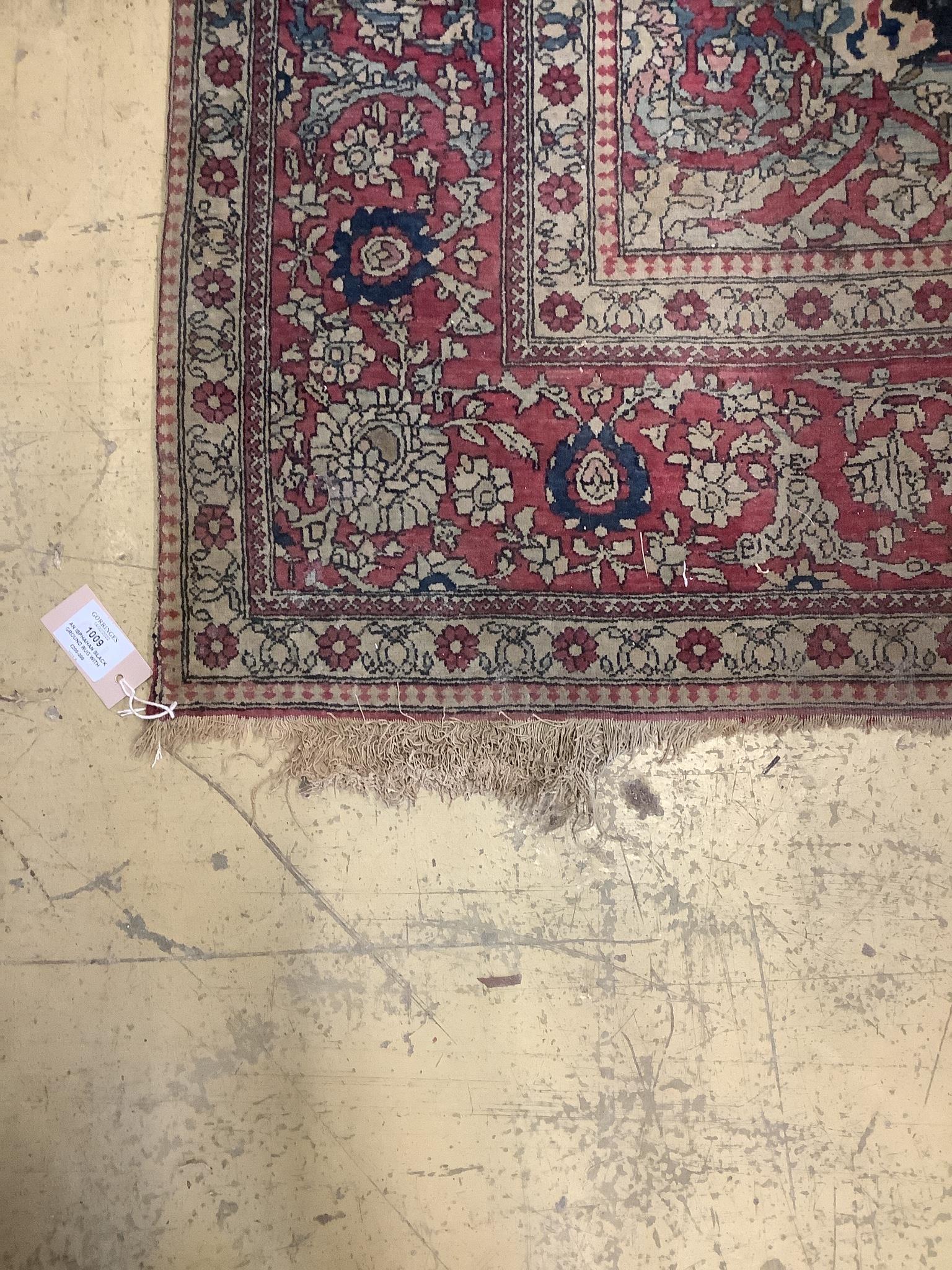 An Isphahan black ground rug with central foliate medallion, mulit-bordered, 202 x140cm